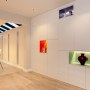 WEYBRIDGE HOUSE | Hallway storage with multi-coloured niches | Interior Designers
