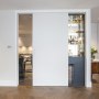 Kensington church street apartment refurbishment | Kitchen and hidden cocktail bar | Interior Designers