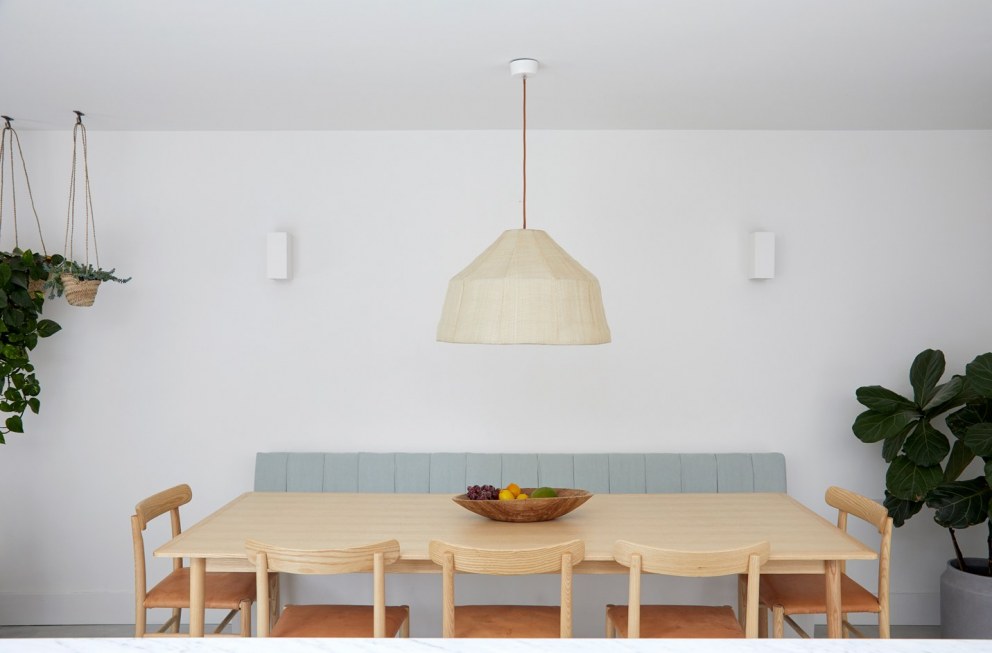 Brixton Townhouse II | Dining area with bespoke banquette seating | Interior Designers