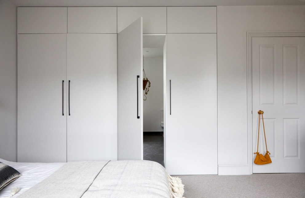 Brixton Townhouse II | Master bedroom leading to bathroom | Interior Designers