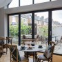 ThirtyEight, Summertown Oxford | Central dining room with large windows looking out onto the private courtyard | Interior Designers