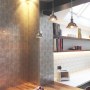 Muswell Hill refurbishment | Distressed bronze backed glass wrap around panel | Interior Designers
