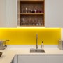 Kensington Basement | White kitchen with yellow splashbacks | Interior Designers