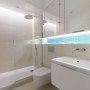 Kensington Basement | Limestone shower room | Interior Designers