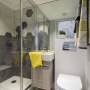 Cosy & Contemporary Basement Apartment in Belsize Park | Cosy & Contemporary - Kids Bathroom | Interior Designers