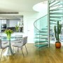 Saffron Square Penthouse | Dining Space and Spiral Staircase | Interior Designers