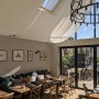 ThirtyEight, Summertown Oxford | Main dining room with bespoke linen ceiling sails, softening the view out onto the private courtyard | Interior Designers