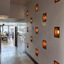 ThirtyEight, Summertown Oxford | Corridor between bar and restaurant showing wall with recessed lighting | Interior Designers