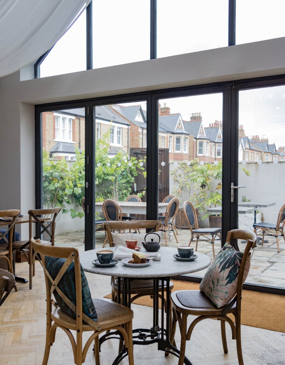 ThirtyEight, Summertown Oxford | Central dining room with large windows looking out onto the private courtyard | Interior Designers