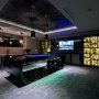 Ultimate mancave from awkward garage | The pool and sports action room | Interior Designers