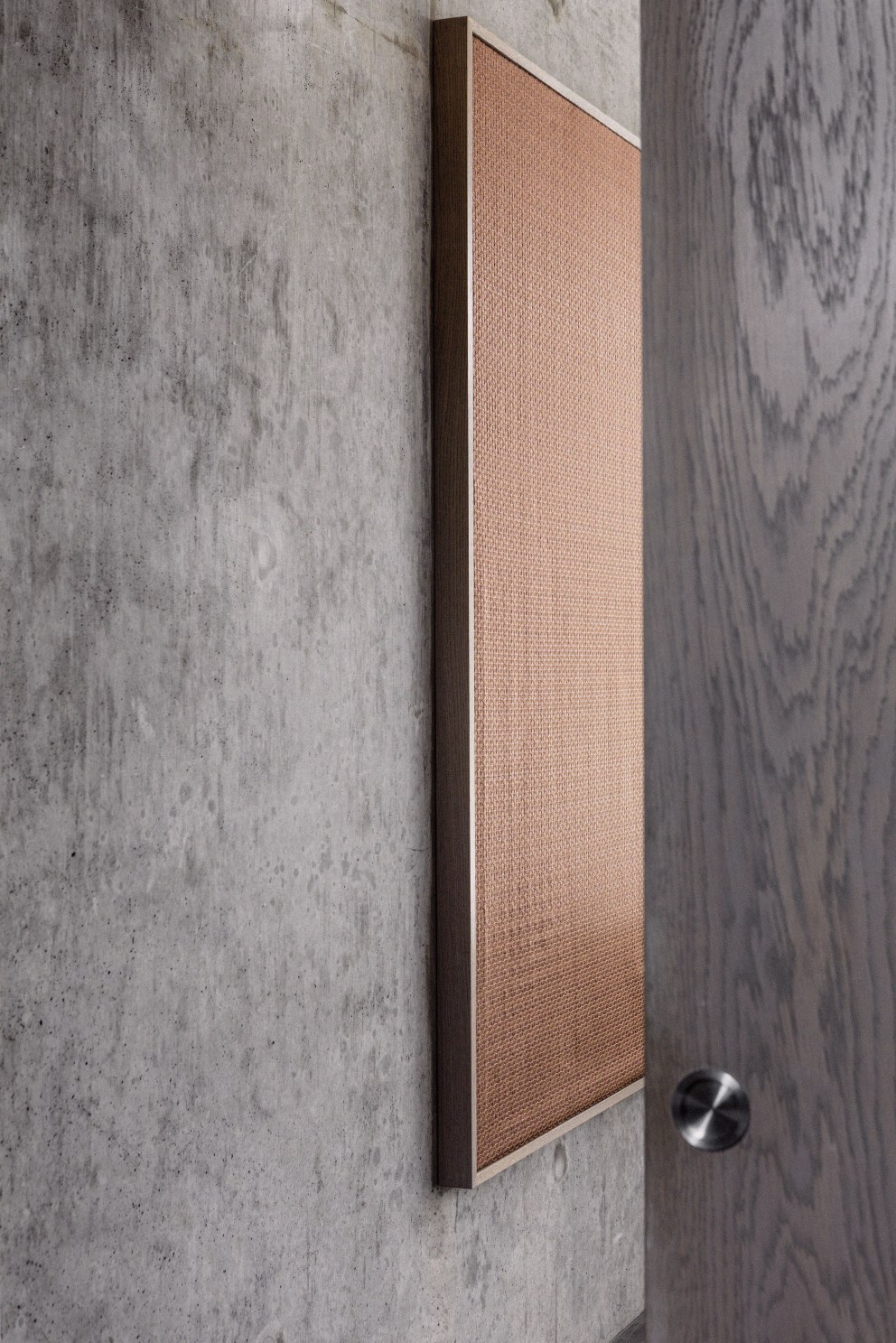 Teddington - New build home | Copper art and exposed concrete wall | Interior Designers