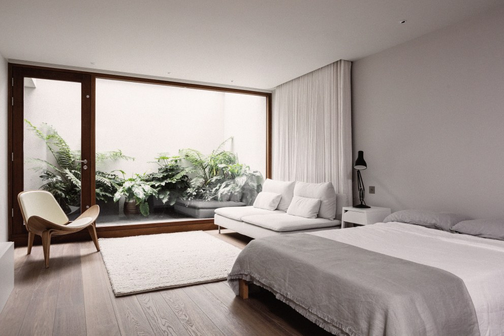 Teddington - New build home | Basement bedroom with large windows | Interior Designers