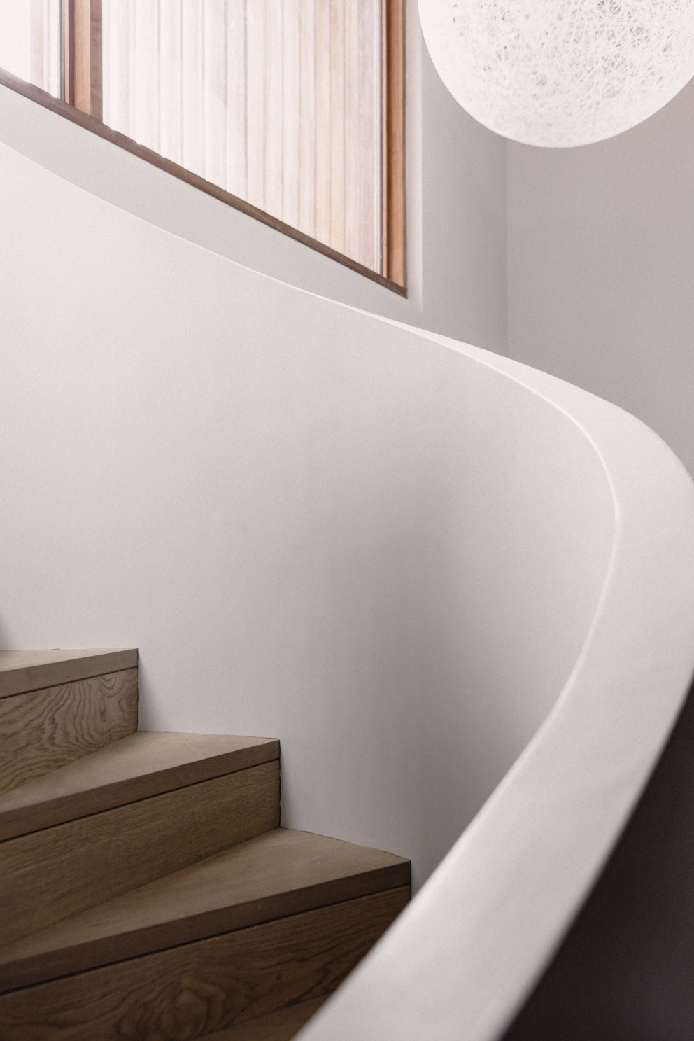 Teddington - New build home | Spiral staircase detail | Interior Designers
