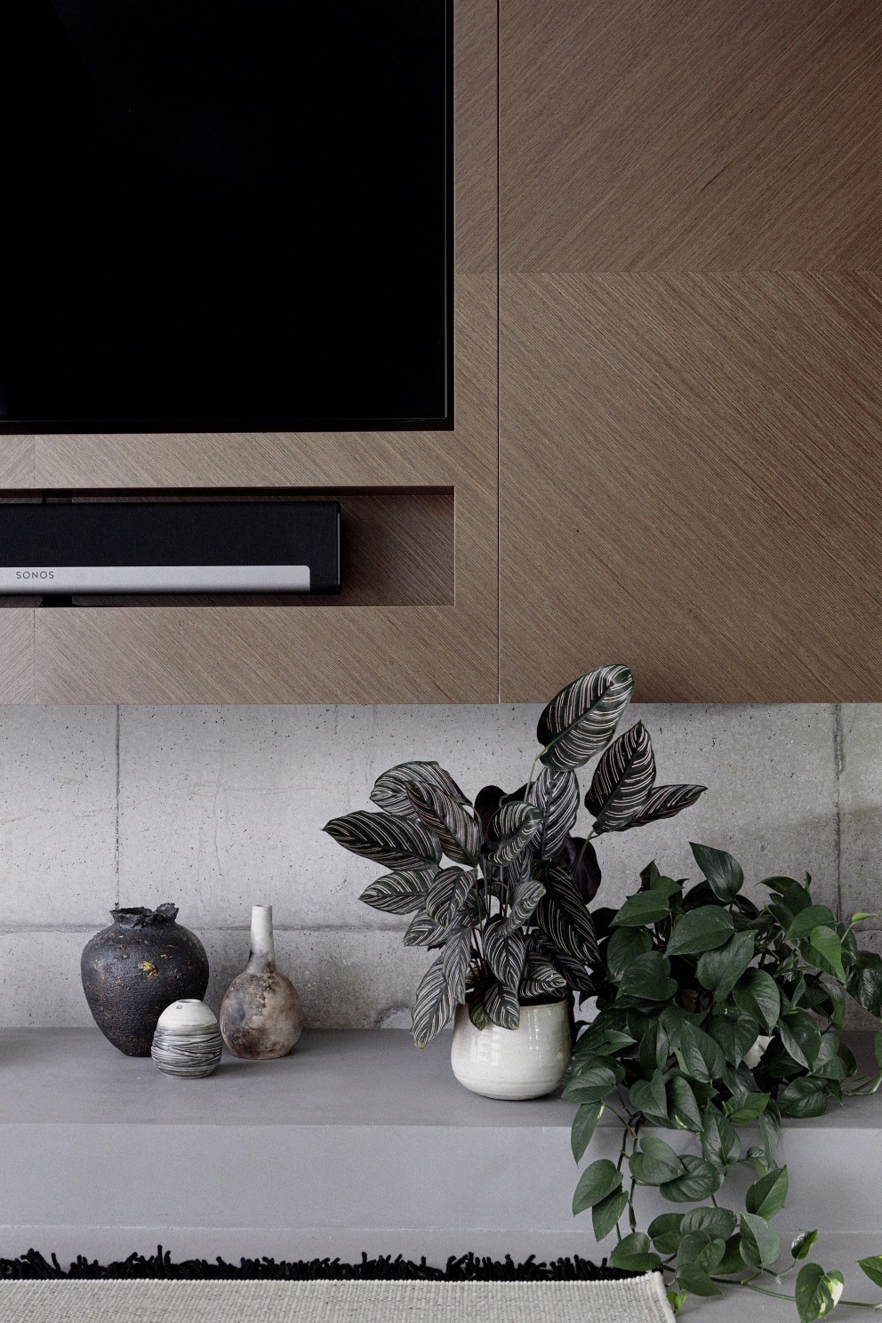 Wimbledon - New build home | Bespoke TV unit detail, chevron veneer | Interior Designers
