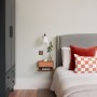 Victorian Terrace, Brockley | Guest bedroom with vibrant pillows | Interior Designers