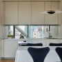 Bankside Apartment | Contemporary kitchen with steel & mirror | Interior Designers