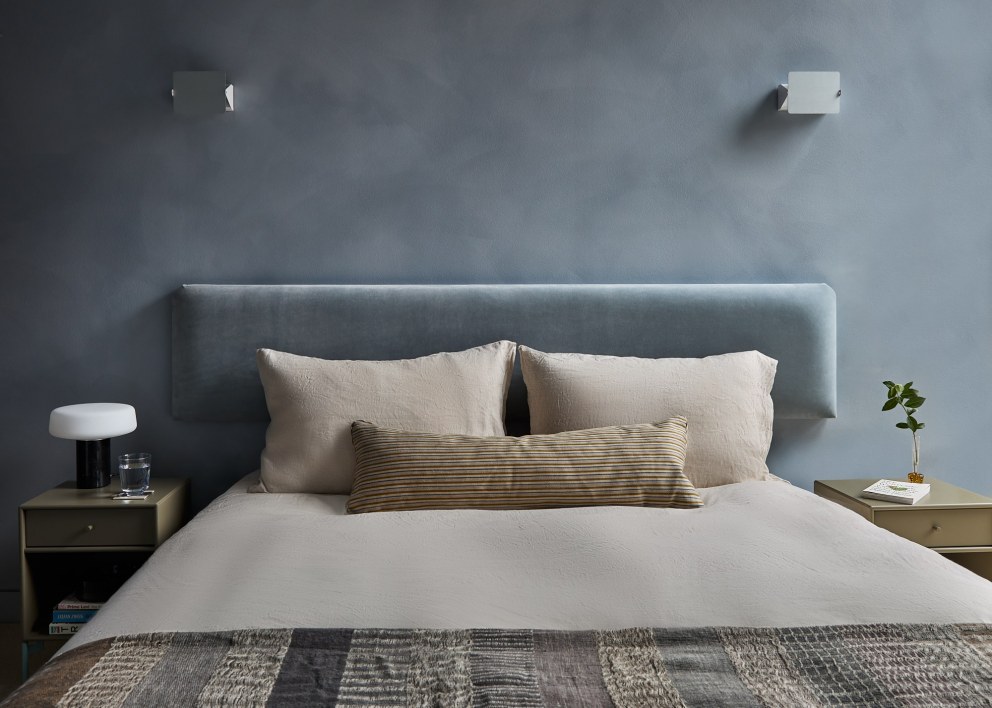 Bankside Apartment | Calm blue bedroom with limewash walls | Interior Designers
