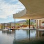 Family Retreat, Nevada | Poolside view, cabanas and outdoor kitchen | Interior Designers