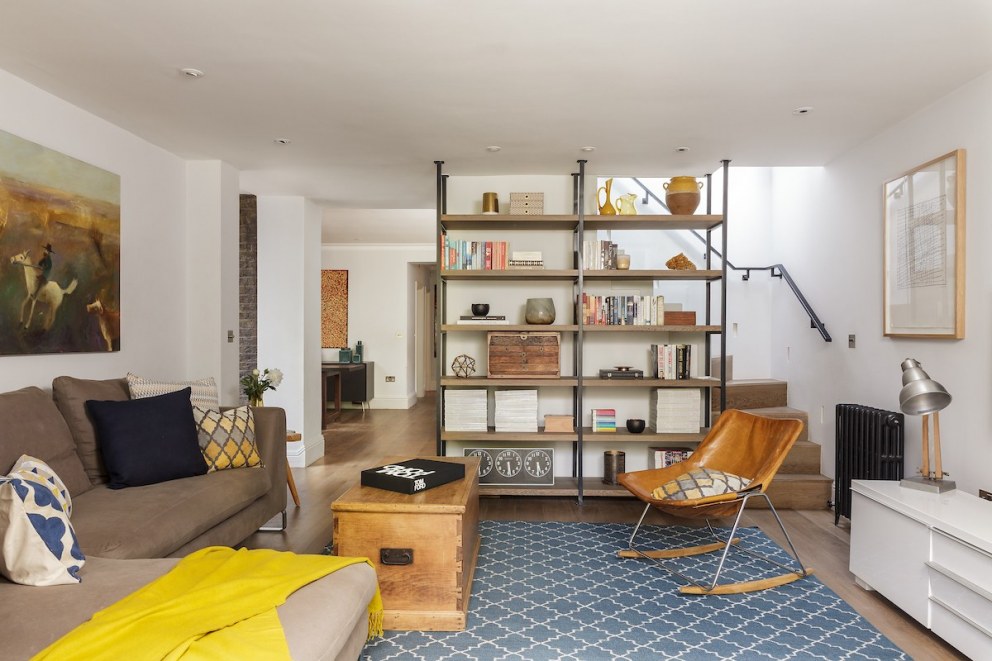 Belsize Park Basement Apartment | Living Room - Bespoke Bookcase and Staircase | Interior Designers