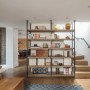 Belsize Park Basement Apartment | Living Room - Bespoke Bookcase and Staircase | Interior Designers