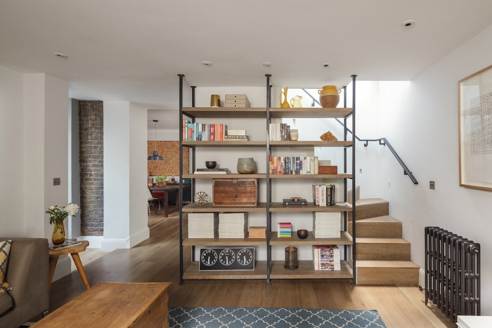 Belsize Park Basement Apartment | Living Room - Bespoke Bookcase and Staircase | Interior Designers