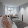 Belsize Park Basement Apartment | Basement Master Bedroom - Bespoke Joinery & windowseat | Interior Designers
